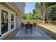 Inviting backyard deck with outdoor seating and a view of the well-maintained, fenced yard at 2525 Ashton Dr, Roswell, GA 30076