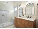 Bathroom features a glass-enclosed shower, marble tiles, and double vanity at 2525 Ashton Dr, Roswell, GA 30076