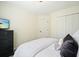 Bedroom features a queen bed with white bedding, dark dresser and closet space at 2525 Ashton Dr, Roswell, GA 30076