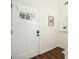 Inviting entryway featuring a stylish front door with glass, complemented by wood floors and neutral decor at 2525 Ashton Dr, Roswell, GA 30076
