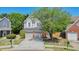 Charming two-story home featuring a two-car garage and a well-manicured front yard, offering curb appeal and functionality at 2525 Ashton Dr, Roswell, GA 30076
