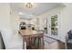 Eat-in kitchen features stainless appliances, white cabinets, and a view to the outdoors through French doors at 2525 Ashton Dr, Roswell, GA 30076