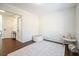 Bright living room with white walls, dark floors, white rug, and panel moulding at 2525 Ashton Dr, Roswell, GA 30076