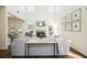 Bright living room with soaring ceilings, a cozy fireplace, and ample natural light at 2525 Ashton Dr, Roswell, GA 30076