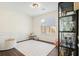 Bright living room with white walls, dark floors, white rug, and a black shelving unit at 2525 Ashton Dr, Roswell, GA 30076