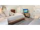 Bedroom features a neutral palette, carpet, sitting area and a modern TV at 2525 Ashton Dr, Roswell, GA 30076