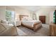 Bedroom features a neutral palette, carpet, and natural light from large windows at 2525 Ashton Dr, Roswell, GA 30076