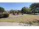 Community playground featuring multiple slides and swings, ideal for recreation and outdoor fun at 2525 Ashton Dr, Roswell, GA 30076