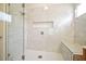 Bathroom showcases a glass-enclosed shower with marble tiling, seating area and niche at 2525 Ashton Dr, Roswell, GA 30076