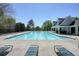 Community pool surrounded by lounge chairs and a covered area, offering a relaxing and enjoyable leisure space for residents at 2525 Ashton Dr, Roswell, GA 30076
