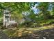 A large backyard with a wood patio deck and lots of green scenery at 446 Harold Ne Ave, Atlanta, GA 30307