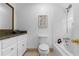 Clean bathroom featuring a white vanity, toilet, and a shower-tub combo at 446 Harold Ne Ave, Atlanta, GA 30307