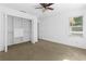 Bedroom has closet, carpeted floor, ceiling fan, and an open door to the hall at 446 Harold Ne Ave, Atlanta, GA 30307