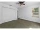 This bedroom has light walls, carpeted floor and contains a closet and ceiling fan at 446 Harold Ne Ave, Atlanta, GA 30307