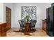 A stylish dining area features a unique table, cowhide rug, black chairs, and ample natural light at 446 Harold Ne Ave, Atlanta, GA 30307