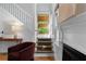 Inviting entryway with hardwood floors, staircase, stylish decor, and a cozy fireplace at 446 Harold Ne Ave, Atlanta, GA 30307