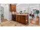 Traditional kitchen features wooden cabinets, black appliances, tile backsplash, and brick colored countertops at 446 Harold Ne Ave, Atlanta, GA 30307