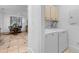 This laundry area features a washer and dryer in an alcove off the hallway at 446 Harold Ne Ave, Atlanta, GA 30307