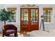 Stylish living room features french doors, ample natural light, and modern furniture at 446 Harold Ne Ave, Atlanta, GA 30307
