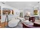 Open-concept living area with staircase, hardwood floors, and a kitchen view at 446 Harold Ne Ave, Atlanta, GA 30307