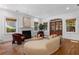 Bright living room features hardwood floors, fireplace, modern furnishings and french doors at 446 Harold Ne Ave, Atlanta, GA 30307