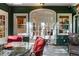 Covered patio with outdoor seating and views into the home, perfect for enjoying peaceful moments and entertaining guests at 446 Harold Ne Ave, Atlanta, GA 30307