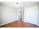Bright bedroom featuring a ceiling fan, closet and wood flooring at 100 Wyngate Chase, Stockbridge, GA 30281
