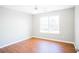 Bedroom featuring a large window and hardwood floors at 100 Wyngate Chase, Stockbridge, GA 30281
