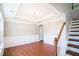 Dining room with a coffered ceiling, hardwood floors, and traditional wainscoting at 100 Wyngate Chase, Stockbridge, GA 30281