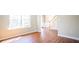 Sun-lit living room featuring beautiful flooring and staircase access at 100 Wyngate Chase, Stockbridge, GA 30281