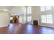 Open concept living area with a soaring ceiling, fireplace and view into kitchen at 100 Wyngate Chase, Stockbridge, GA 30281