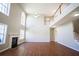 Bright living room with high ceilings, a fireplace, gleaming floors and large windows at 100 Wyngate Chase, Stockbridge, GA 30281