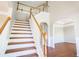 Staircase with wood treads and painted risers that leads to upper level at 100 Wyngate Chase, Stockbridge, GA 30281