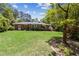 Charming brick home with a large, well-manicured lawn and mature landscaping in the backyard at 1301 Amanda Cir, Decatur, GA 30033