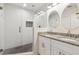 Modern bathroom features a glass-enclosed shower and a double vanity with granite countertops at 1301 Amanda Cir, Decatur, GA 30033