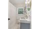 Modern bathroom with a unique sink, stylish fixtures, and a window with natural light at 1301 Amanda Cir, Decatur, GA 30033