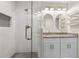 Updated bathroom with a glass-enclosed shower and a double vanity with granite countertops at 1301 Amanda Cir, Decatur, GA 30033