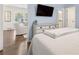 Bright bedroom boasts hardwood floors and a large dresser with a mounted television at 1301 Amanda Cir, Decatur, GA 30033