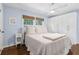 Serene bedroom features hardwood floors, a ceiling fan, and lots of natural light at 1301 Amanda Cir, Decatur, GA 30033