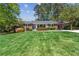 Beautiful brick home with a manicured front lawn and colorful landscaping, offering great curb appeal at 1301 Amanda Cir, Decatur, GA 30033