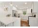 Bright kitchen featuring white cabinets, quartz counters, stainless steel appliances and hardwood flooring at 1301 Amanda Cir, Decatur, GA 30033