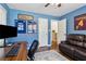 Bright home office space with sports-themed décor and a comfortable seating area at 1301 Amanda Cir, Decatur, GA 30033