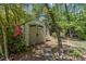 Outdoor storage shed nestled amidst lush greenery, offering practical storage solutions at 1301 Amanda Cir, Decatur, GA 30033