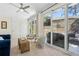 Sunroom with sliding glass doors leading to a private patio with outdoor seating at 1301 Amanda Cir, Decatur, GA 30033
