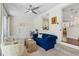 Bright sunroom with neutral decor, ceiling fan, and door leading to the outside at 1301 Amanda Cir, Decatur, GA 30033