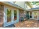 Back deck with brick home boasts ample space for outdoor dining and entertaining at 1851 Mount Vernon Rd, Dunwoody, GA 30338