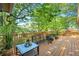 Spacious back deck surrounded by lush greenery offers a serene retreat at 1851 Mount Vernon Rd, Dunwoody, GA 30338