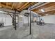 Unfinished basement with concrete flooring and exposed ductwork is ready for customization at 1851 Mount Vernon Rd, Dunwoody, GA 30338