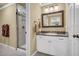 This charming bathroom features a glass shower at 1851 Mount Vernon Rd, Dunwoody, GA 30338