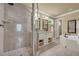 This bathroom features a glass enclosed shower and a soaking tub at 1851 Mount Vernon Rd, Dunwoody, GA 30338